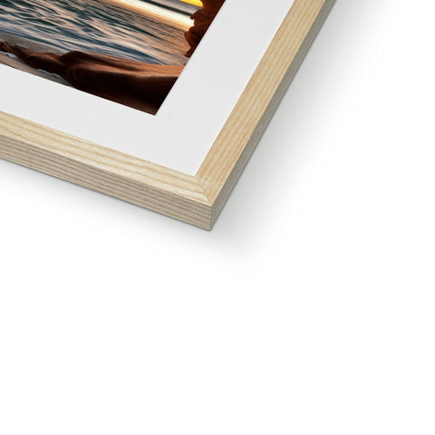 A picture of wood on a book shelf with a photograph in a picture frame