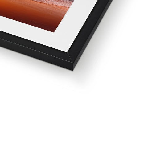 A picture frame sitting on top of a wall with a large print in it.