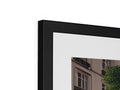 A photograph of a photo is displayed on a black picture frame.