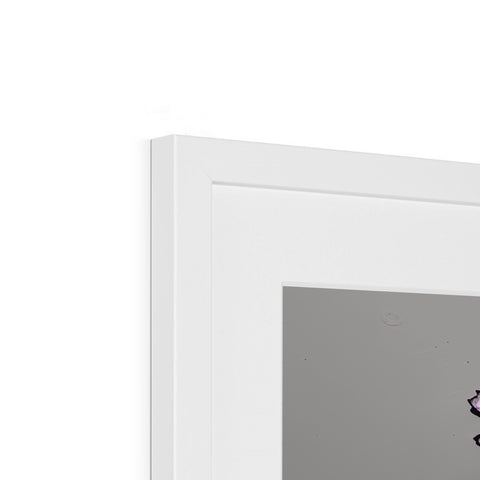 A white picture frame sits on top of a small fridge.