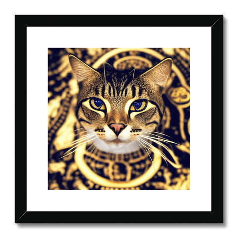 Gold framed art print on a white background next to a cat and a cat on a