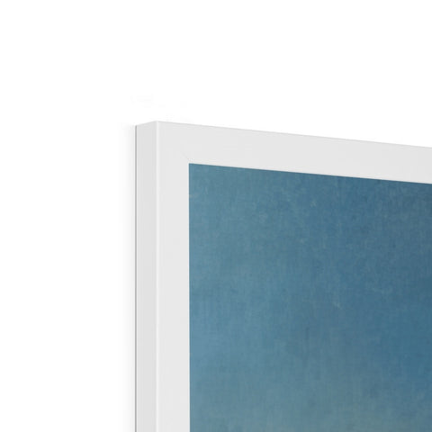 An imac print hanging next to a white and blue painting on a dark wall.