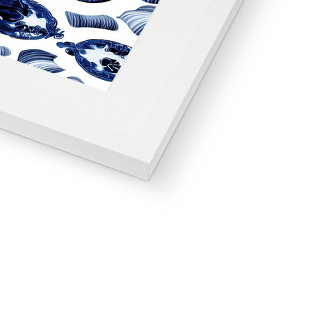 A blue and white picture hanging on the side of the frame of a book.