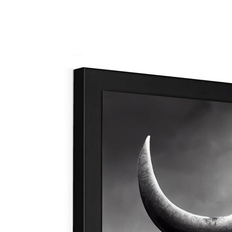An image of a crescent moon and a very big TV on a wall.