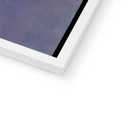 A white flat, colorful picture frame sitting on a table in front of an ipad