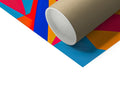 A roll of brown and white paper with various colors tied into it.