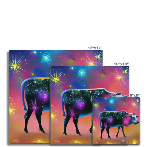 a herd of cows and a cow that is holding a card