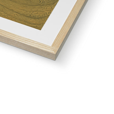 A piece of wood is placed in a white picture frame.