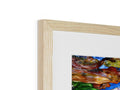 A photo of an art print on a wood frame in a box.