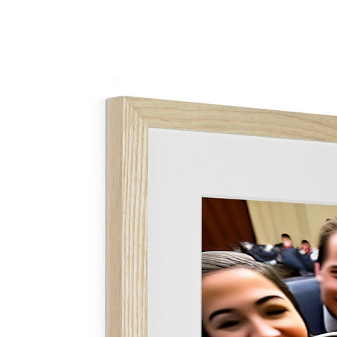 A picture of a wooden photo frame with a man and girl next to it.