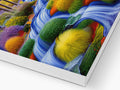 A colorful art print on a white paper card is sitting on top of an open computer