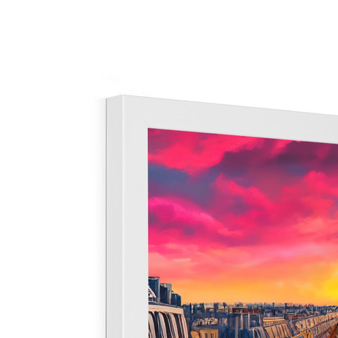 A picture of a sunset with a white background in the sky on a picture frame.