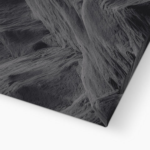 A picture of a piece of gray granite with a black and white photo behind it.