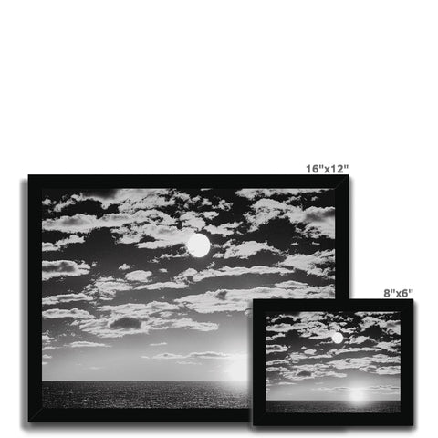 A television display panel with a bunch of black and white pictures of black clouds in the