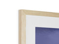 A wooden frame is framed with an image in it on top of a mantel.