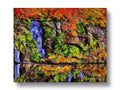 A picture of a rock outcropping with a colorful waterfall is placed on it.