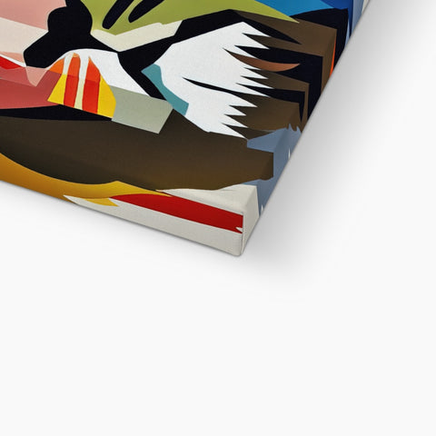 a blanket covered in art print folded up on top of a pillow of a laptop on