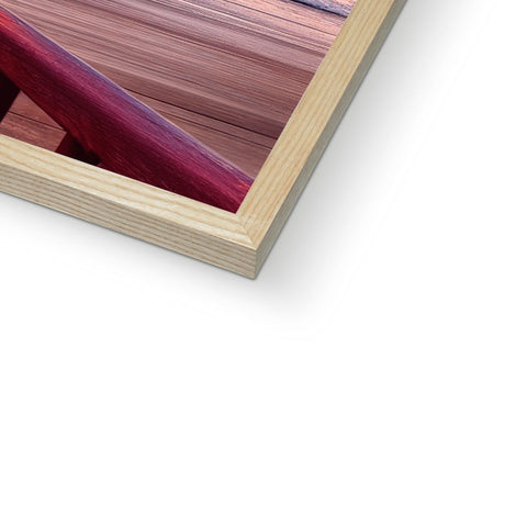 A picture frame with a frame with wood on it that is framed in the red wood
