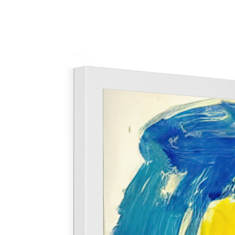 a picture frame filled with a blue, white and yellow painting on an easel.