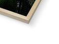 The photo is a photograph of a picture frame above a picture of a wood building on