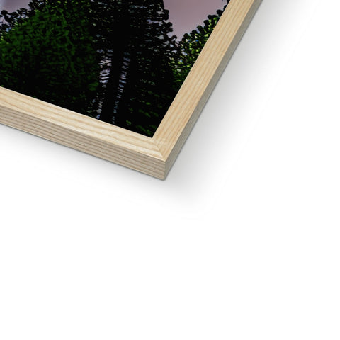 The photo is a photograph of a picture frame above a picture of a wood building on