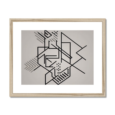 A framed art print with black and yellow geometric design sitting on a counter.