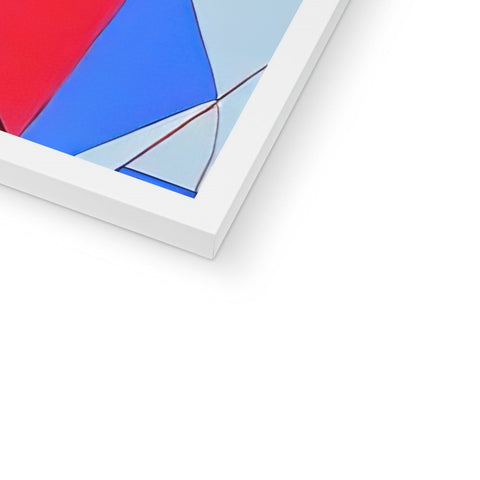 A colorful red triangle in a metal frame near white and blue.