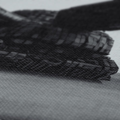 Cloth tablet with pencils made from thin paper on a black background.