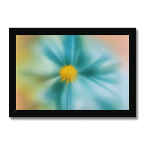 A colorful flower on a white backdrop with small black picture on it.