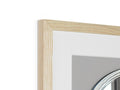 a white mirror and glass picture frame sitting on a frame