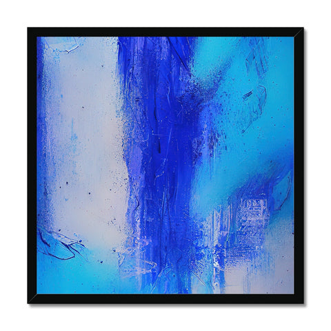 A large blue glass painting on a wall is hanging next to a piece of art on