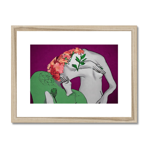 An art print of two woman hugging each other next to flowers on a pillow.