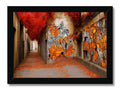 An art print with large butterflies spray on is hanging on a wall.