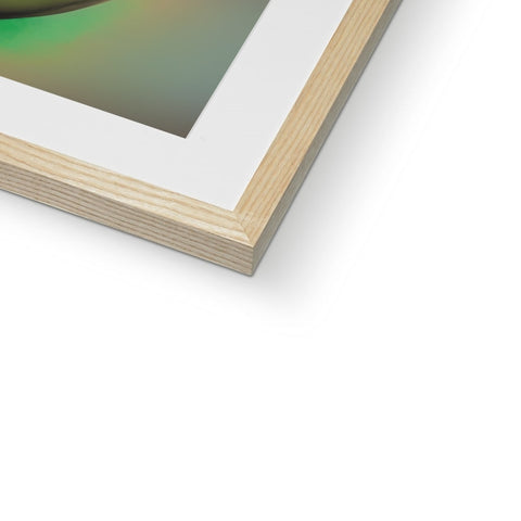 a picture frame with an abstract photograph in a green piece of art on top of it