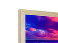 A wooden frame that has a wooden image on a table filled with colorful photos in a