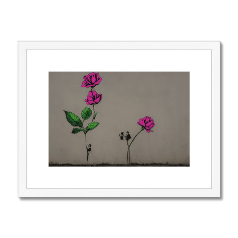 A pink rose next to a hand written note card and an art print.