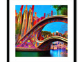 Art prints hanging on the walls of a bridge, the colors are vibrant and bright.