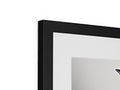 Two pictures are framed in a picture frame on top of a black and white television.