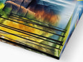 A close up of a photo of the softcover book that is folded on the computer
