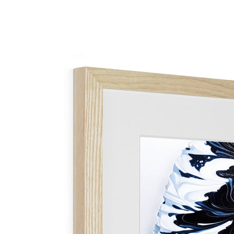 A pillow holding a picture of a white and blue floral pillow is placed in a frame