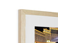 A photo of a large wooden photo framed in a photo frame on a table.