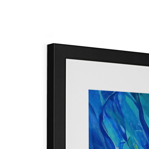 A print of an abstract painting hangs on a piece of artwork in a frame.