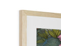 A picture frame adorned with flowers and artwork in a wooden object.