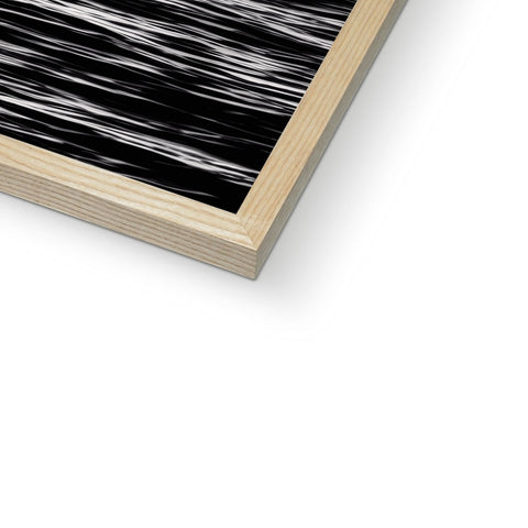 Wood panels sit on top of a couch on a black wooden background.
