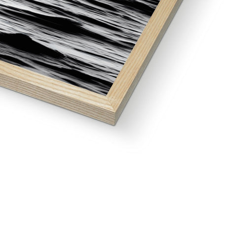Two black and white photographs of wood on a wooden panel.