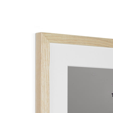 A picture frame with a picture on it holding a wooden object.