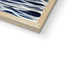 A picture is of a wood frame holding a print on a white canvas on the wooden