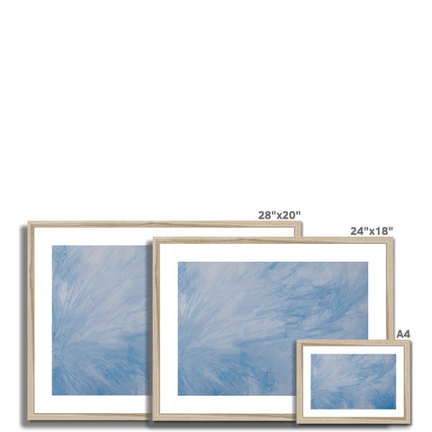 a picture frame on a wooden frame and a blue curtain and glass picture frames