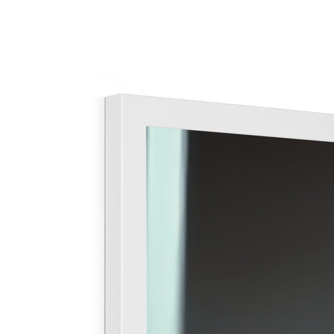 An imac monitor sitting atop a window in a white room.