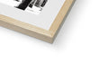 A picture of a wood framed book with a photo on a black and white piece of
